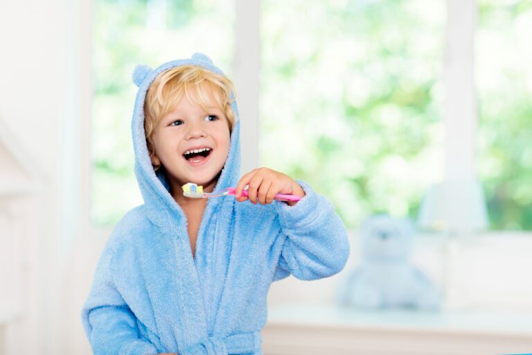 Toddler boy brushing his teeth