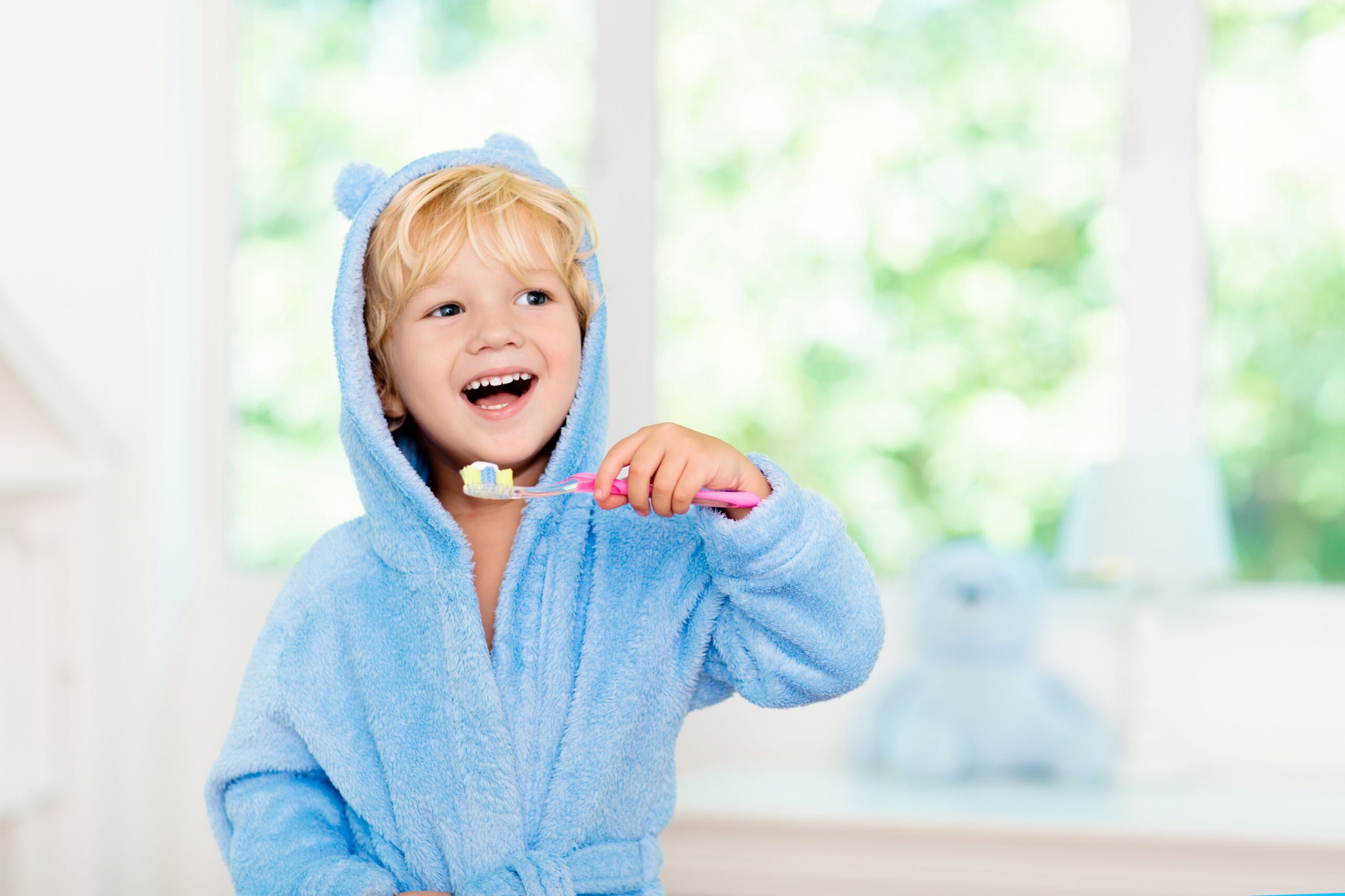 Toddler boy brushing his teeth